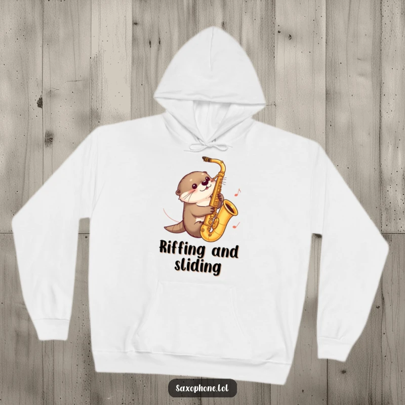 Funny hoodie featuring a curious otter sliding down a saxophone, with music notes trailing, capturing a moment of joyful aquatic fun.